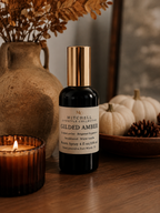 Gilded Amber room spray on a styled tabletop