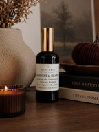Harvest and Hearth room spray on a styled tabletop