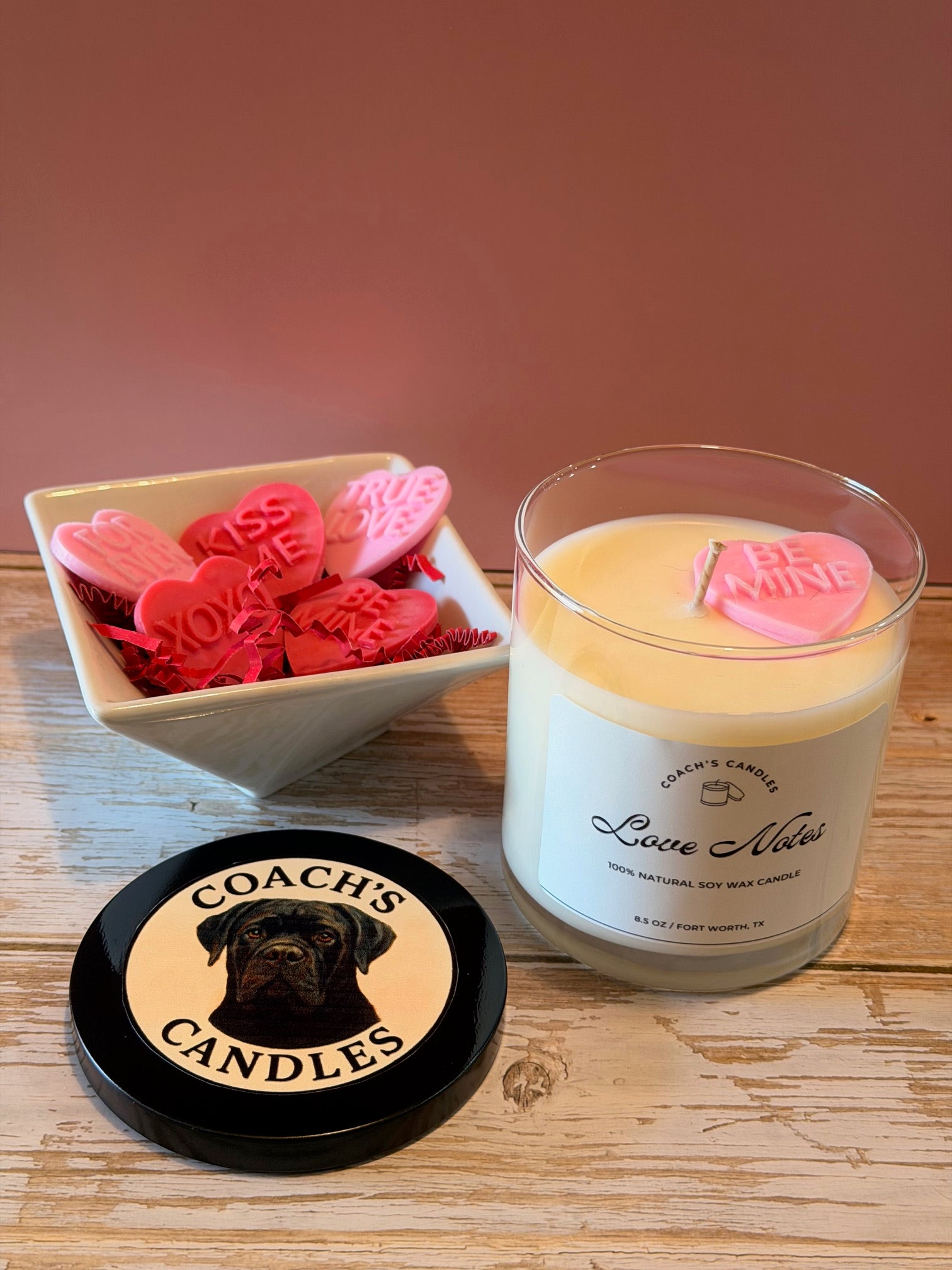 Love Notes soy candle by Coach’s Candles styled in a cozy bedroom or living space