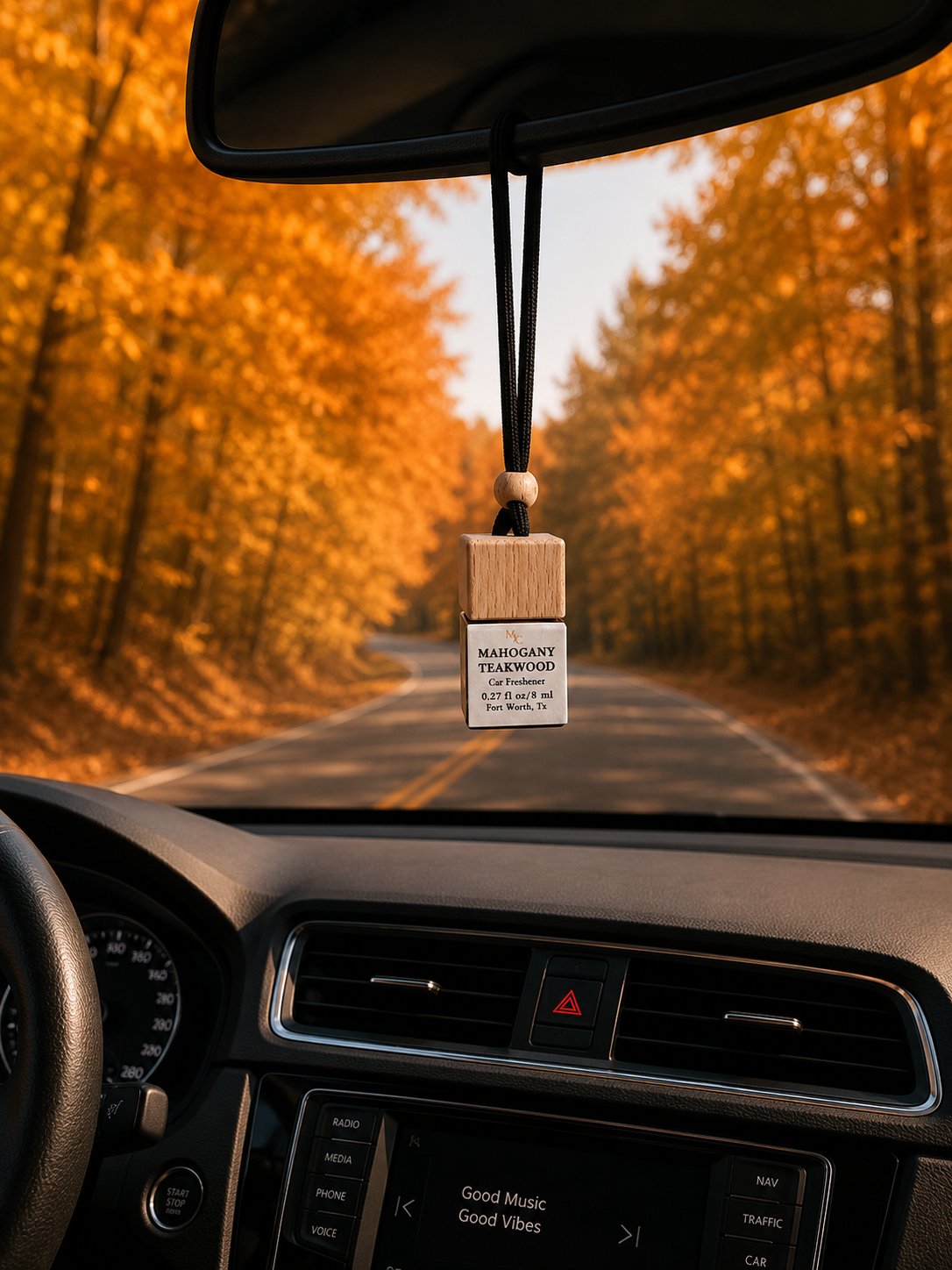 Mahogany Teakwood car diffuser hanging from car mirror