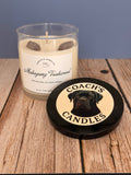 Mahogany Teakwood soy candle by Coach’s Candles styled in a warm, cozy home setting