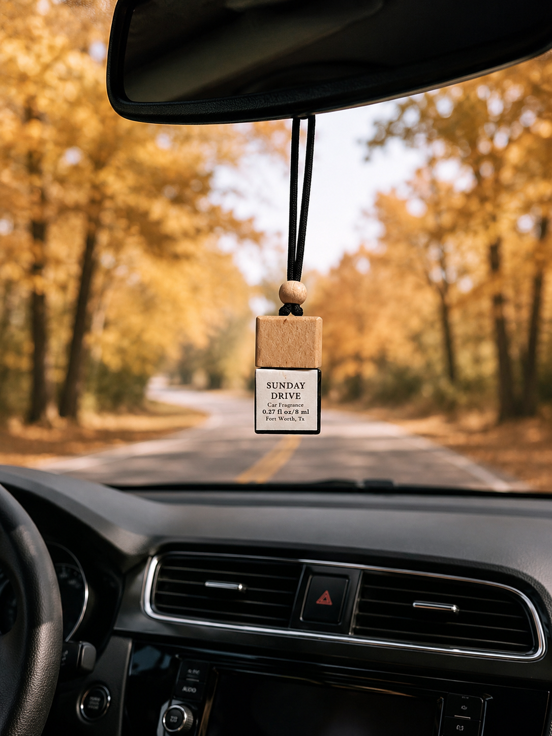 Sunday Drive car diffuser hanging from car mirror