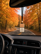 Warm Plaid car diffuser hanging from car mirror