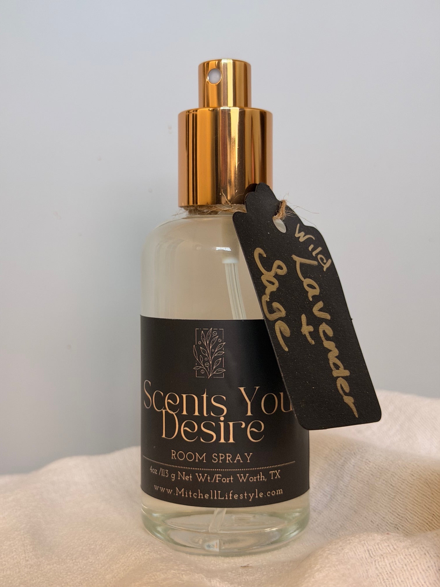 Wild Lavender and Sage luxury room spray by Scents You Desire in a serene, spa-inspired space